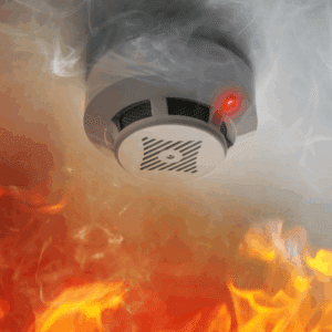 Family practicing fire safety plan and checking smoke detectors